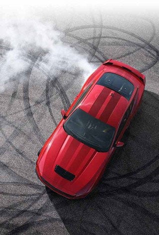 Overhead view of a 2024 Ford Mustang® model with tire tracks on pavement | Bailey Toliver Ford in Stanton TX