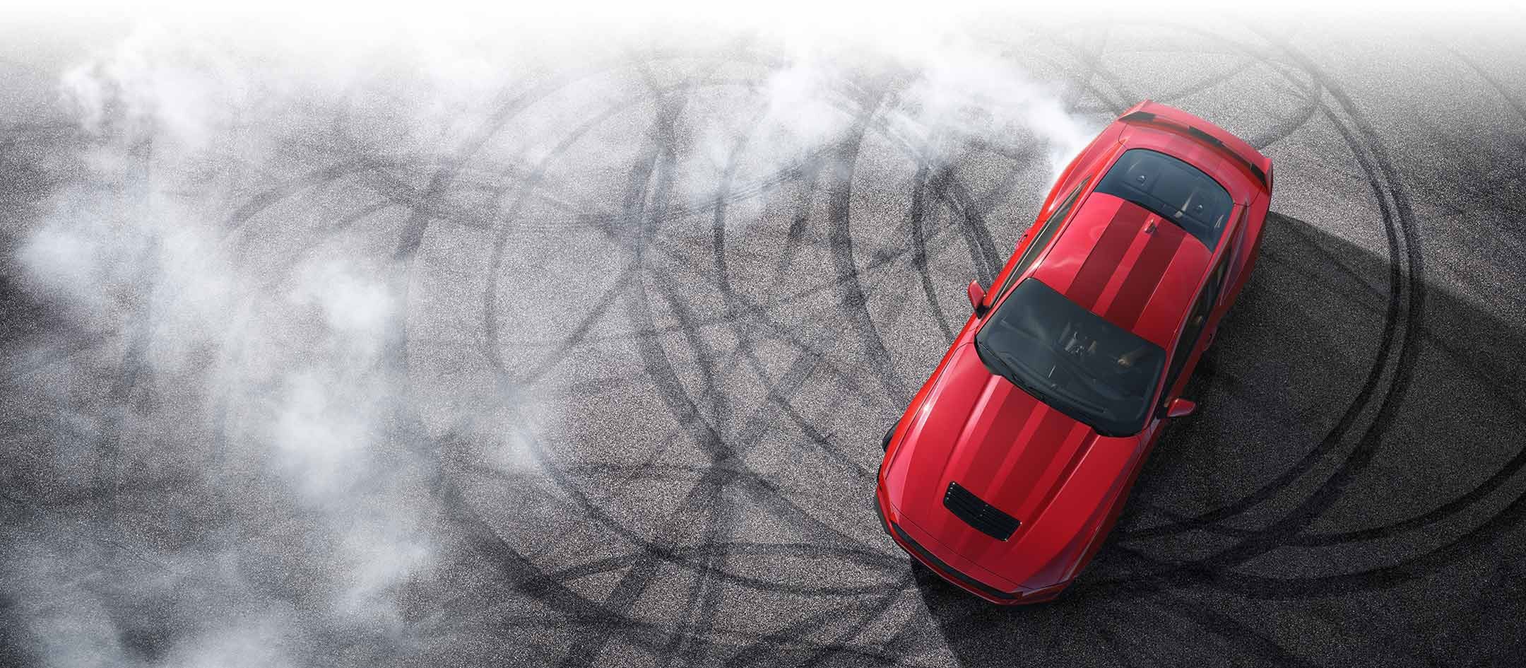 Overhead view of a 2024 Ford Mustang® model with tire tracks on pavement | Bailey Toliver Ford in Stanton TX